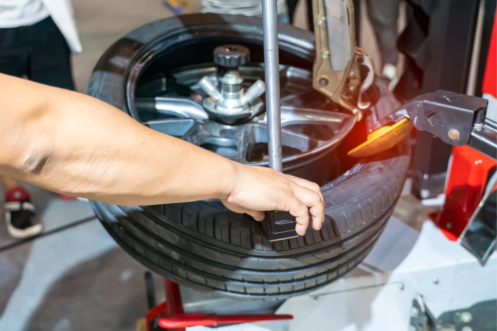 Mechanic working on tire installation
