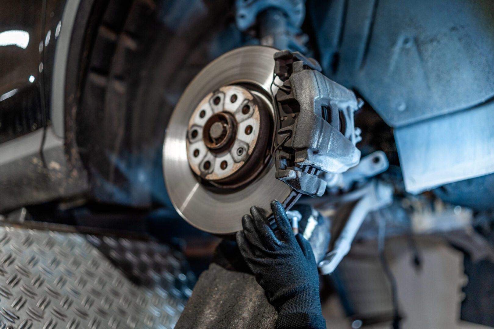 Car brake disc being repaired